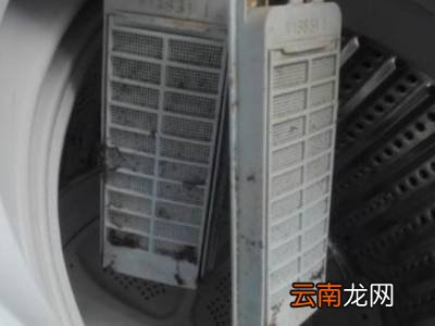 老式洗衣机里的赃物袋怎么取